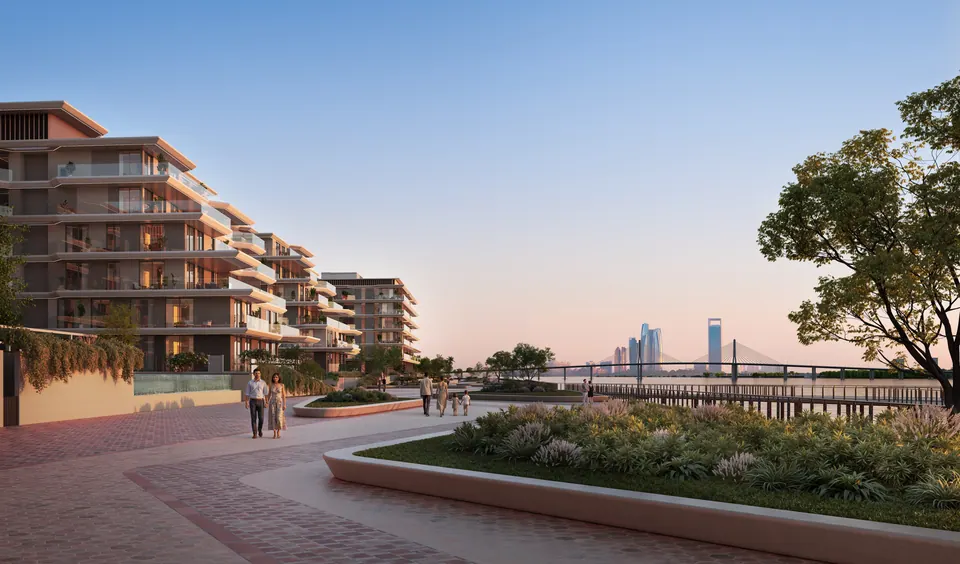 Bashayer Residences: landscaped promenade in front of the apartment buildings at dusk, developer render