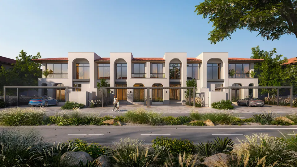 Nawayef Village: row of two-storey townhouses with arched facades along a landscaped street, developer render
