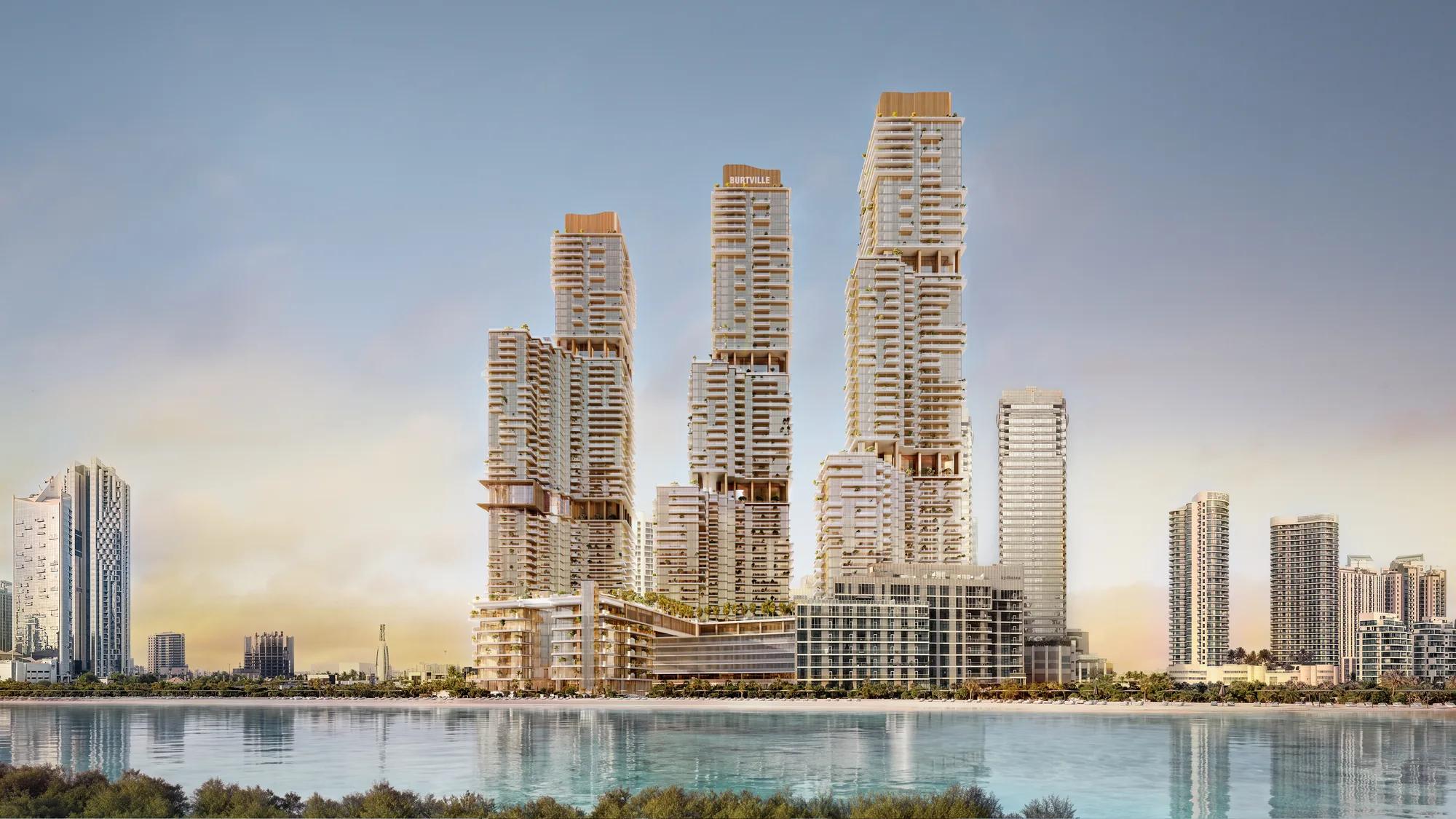 The three towers, the podium and the Beach Club seen from across the water
