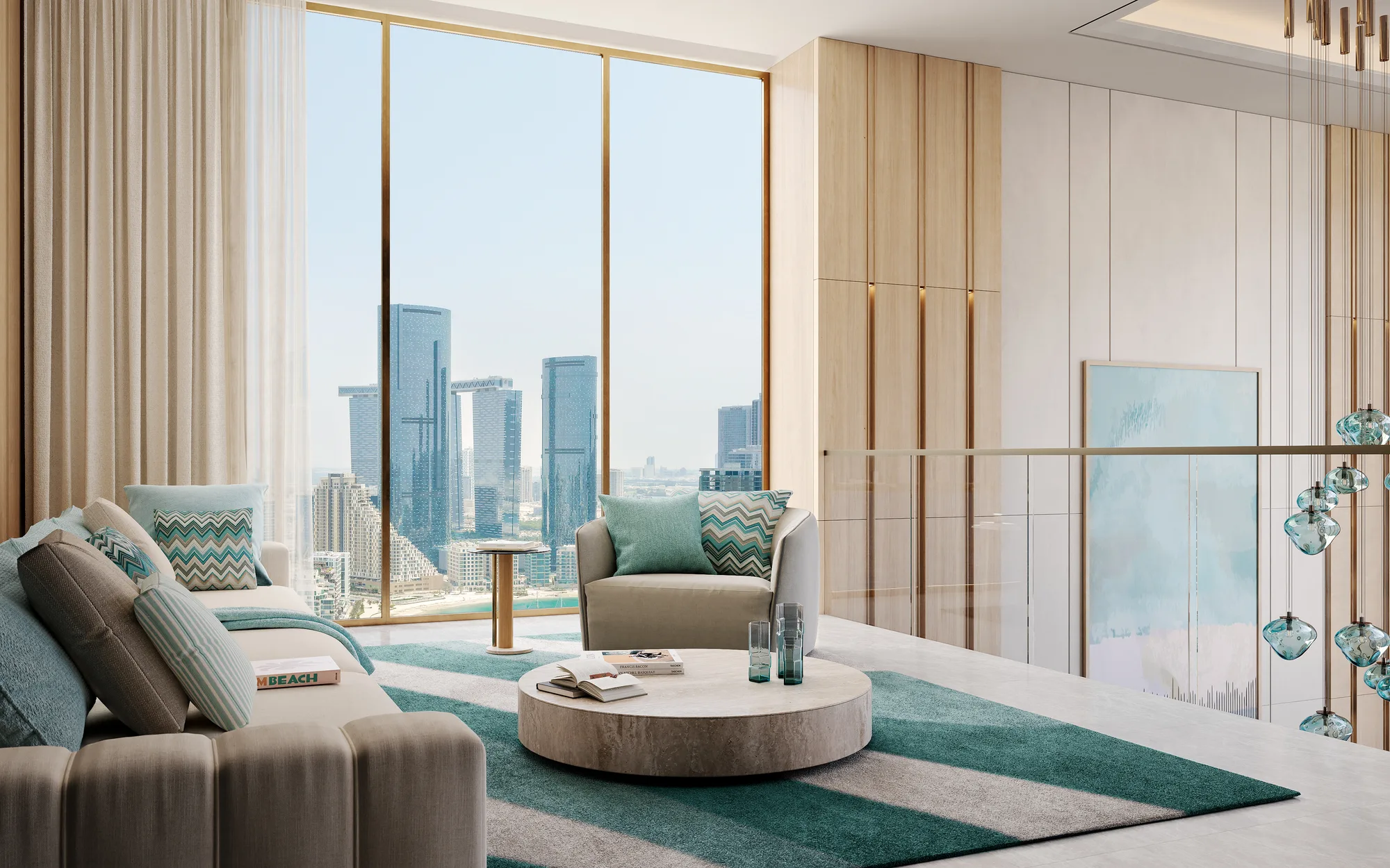 A living area on the upper level of a duplex, with the city skyline through floor-to-ceiling glass