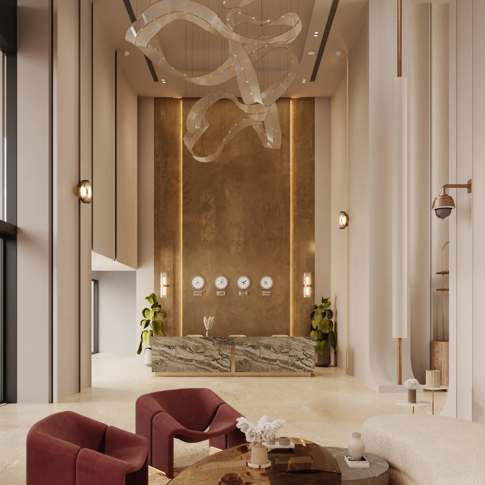 The double-height reception lobby: a grey marble reception desk against a bronze wall with four world clocks, a sculptural ribbon chandelier and burgundy armchairs