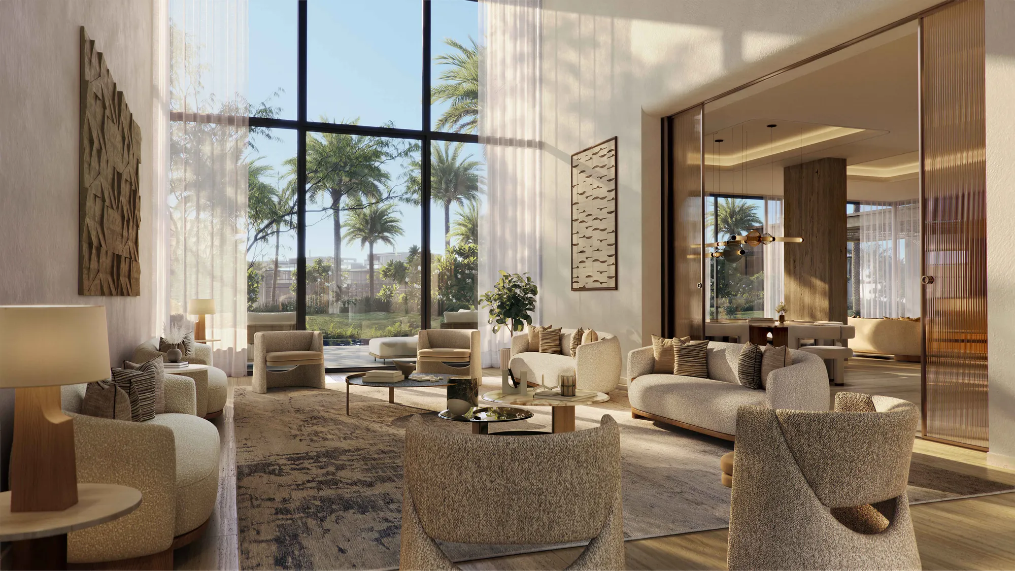 The double-height living room of a five-bedroom villa, floor-to-ceiling glass onto the garden