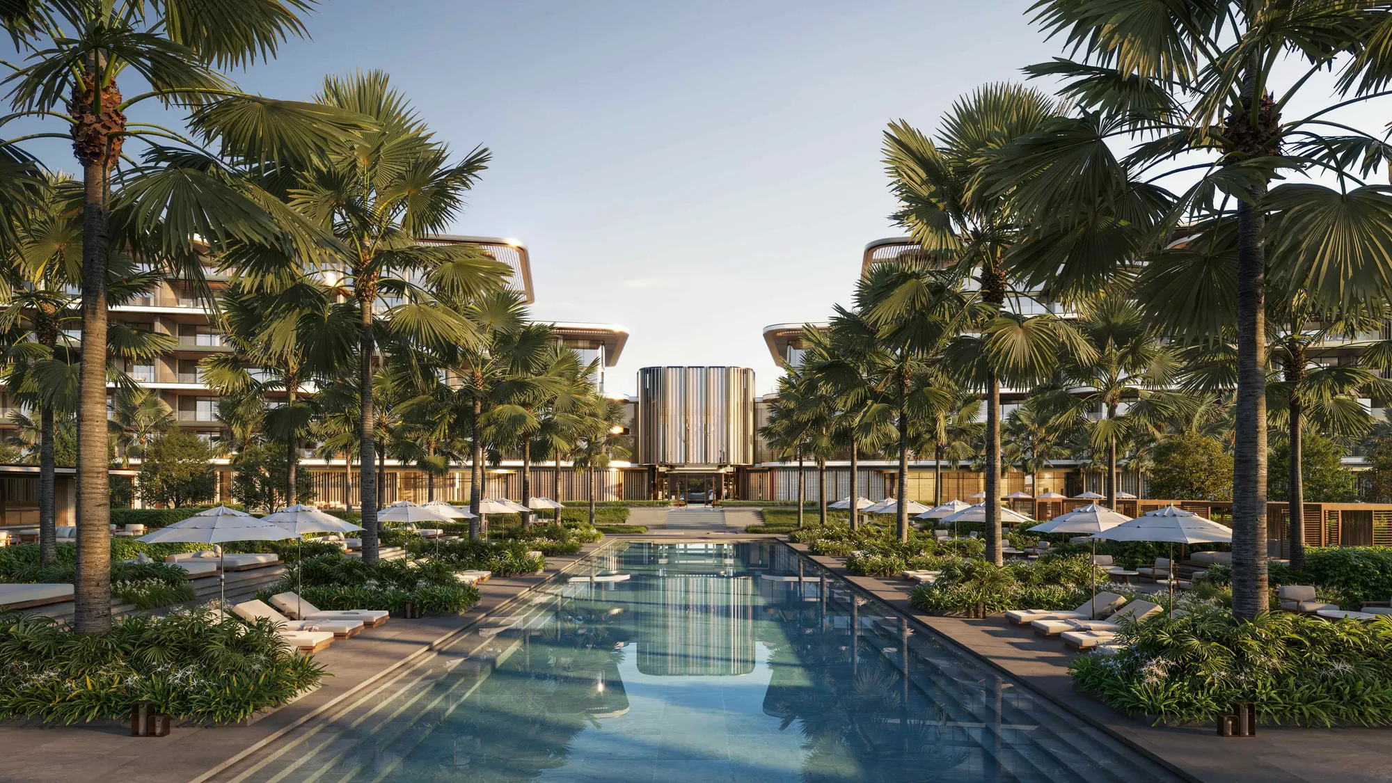 The pool axis between palms, towards the suites building