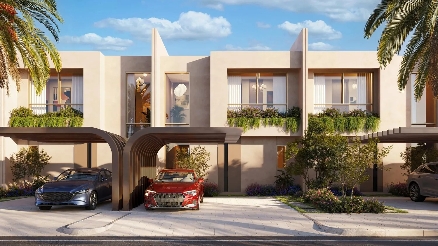 A townhouse carport: a curved canopy over two parked cars, planted balconies above and the neighbouring homes along the street
