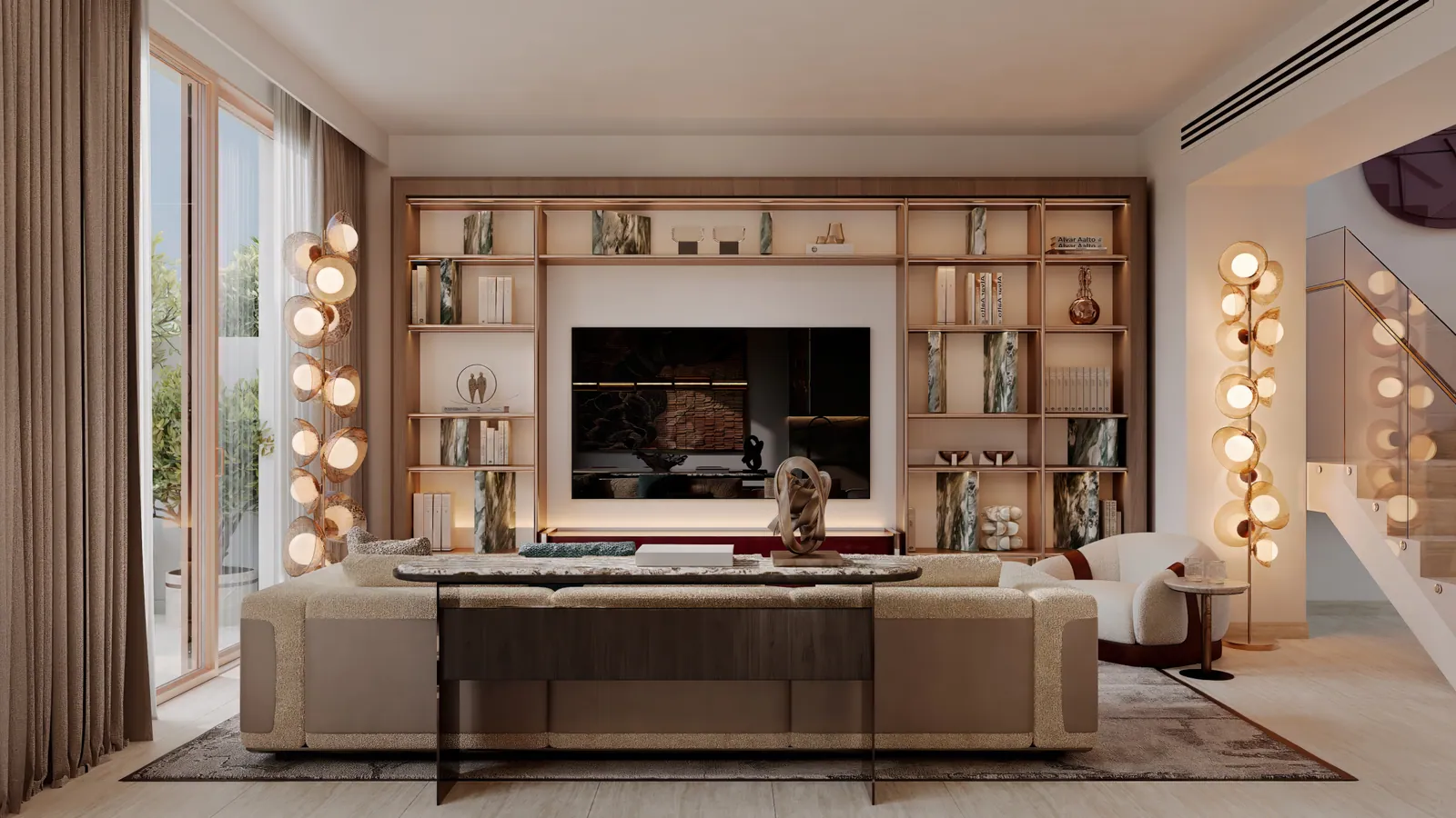The living room of a 3-bedroom duplex: a sofa facing a wall of shelving around the television, sculptural wall lights and the staircase at right