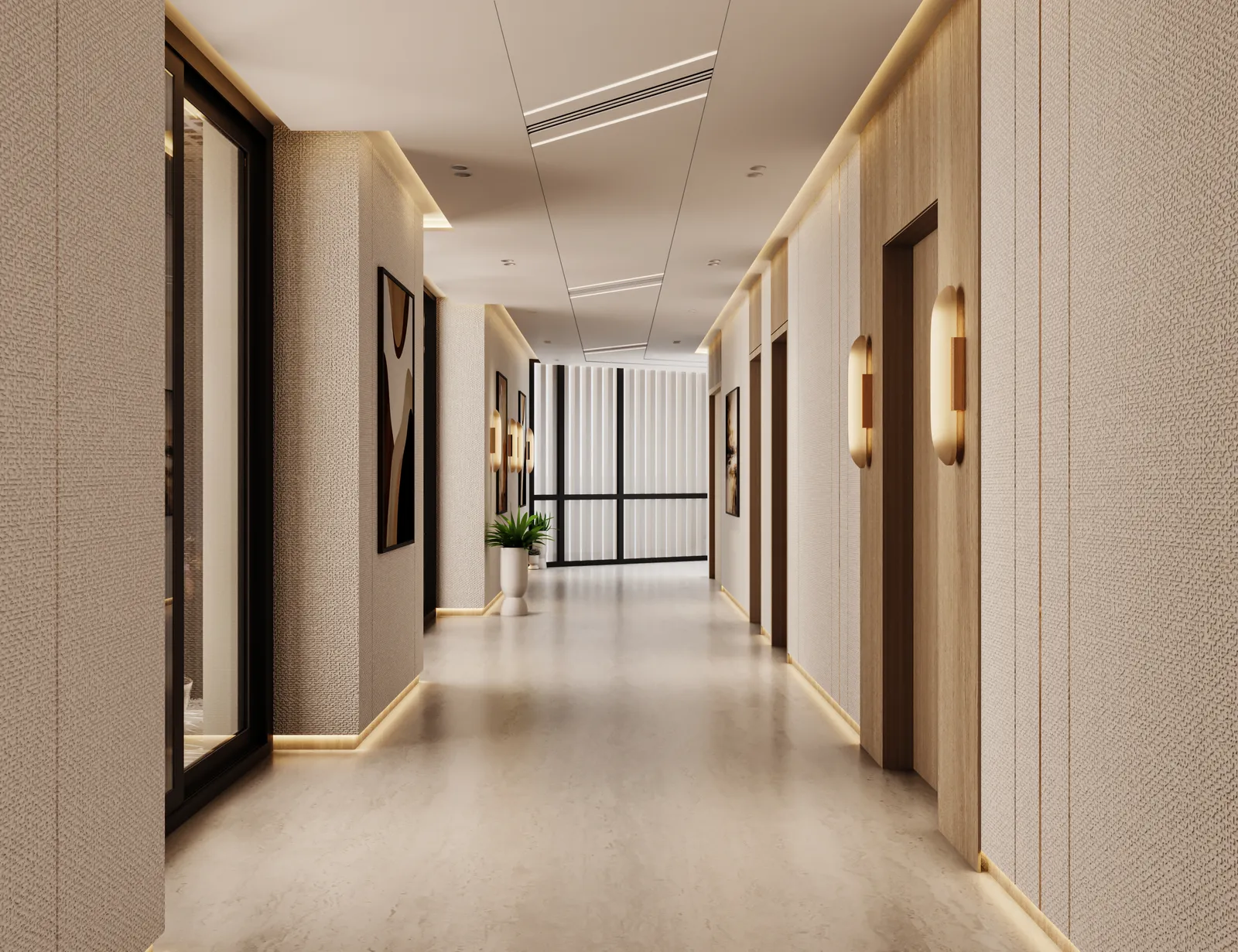 A residential corridor: cream walls with brass wall lights and framed prints, apartment doors on the left and a window at the end