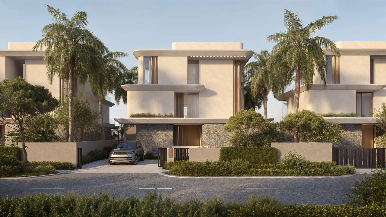 The villa’s street side: the driveway, the gate and three storeys under palms