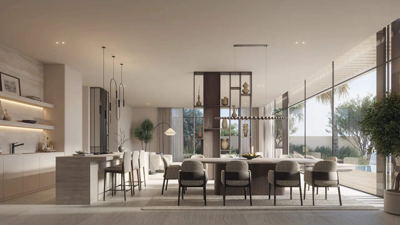 The dining room and kitchen island, glass walls to the garden